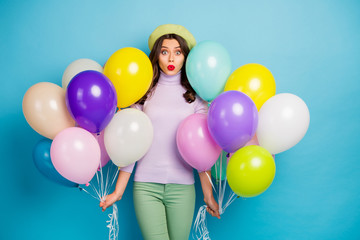 Poster - Photo of funny lady carry many colorful air balloons unexpected surprise party open mouth wear purple jumper beret cap green pants isolated blue color background