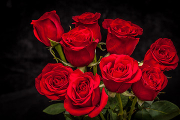 Poster - bouquet of beautiful red roses on a black background