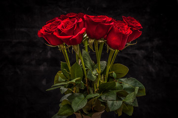 Poster - bouquet of beautiful red roses on a black background