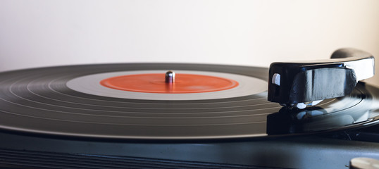 Close up of vinyl record player on a white background. Shallow depth of field, focus select.