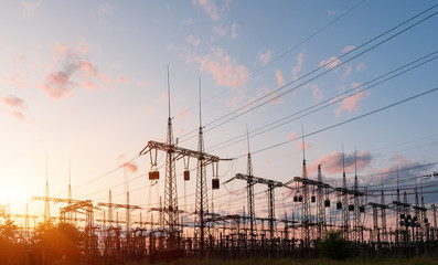 Wall Mural - electrical substation silhouette on the dramatic sunset background