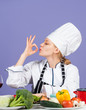 © be free - tastes excellent. fresh and raw preparing. full of vitamin. natural and organic. restaurant kitchen lifestyle. chef cooking vegetables. healthy food and diet. woman housewife in cook hat and apron