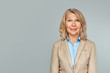 © JENOCHE - Portrait of wonderful business woman on gray background .