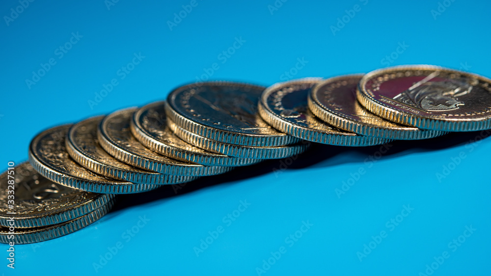 Francs Stack stack of Swiss coins in denominations of two francs lie on a blue ...