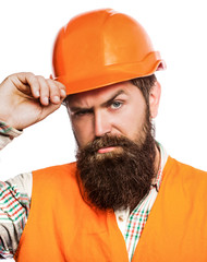 Wall Mural - Bearded man worker with beard in building helmet or hard hat. Man builders, industry. Builder in hard hat, foreman or repairman in the helmet. Portrait architect builder, civil engineer working