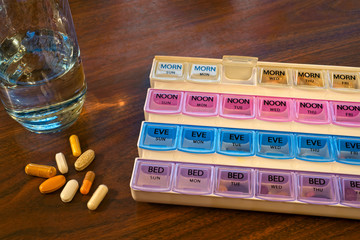 Pill container, pills, and water