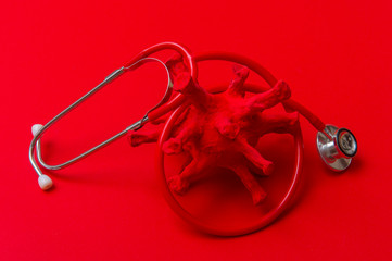 Abstract Virus Strain Model And Stethoscope On red Background. C