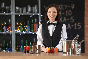 Wall Mural - Beautiful female bartender in pub