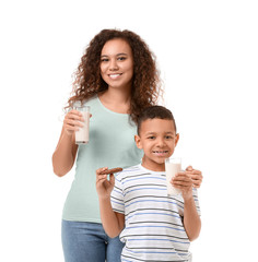 Poster - African-American boy and his mother with milk on white background