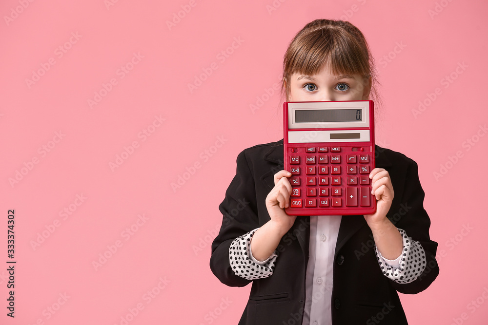 Little girl with calculator on color background