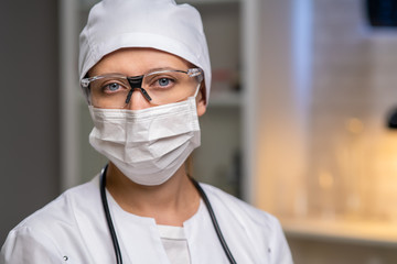 Female Doctor In Laboratory Office On Background