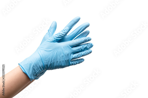 Female hands in disposable gloves on white background. Poster Mural XXL
