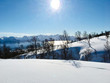 © Flipz - Beautiful view from a snowy mountain on a fjord with a snowy mountain chain, blue sky and the sund in the background in Norway - Landscape Photography