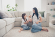© deagreez - Full body photo of adorable cute lovely positive mommy small daughter sit carpet bare foot tell school news conversation in house indoors