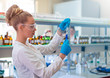 © Vladimir Borovic - Beautiful young woman scientist in laboratory working. Young female scientist doing some research.