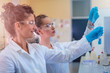 © Vladimir Borovic - Two beautiful young female scientists working in laboratory with test tubes and doing some research