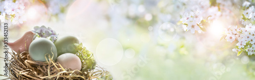 Easter eggs on sunny spring background Wallpaper Mural