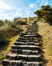 Traditional Stairs Made Of Natural Stone Leading Up A Hill.