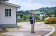 © Pituk - A handsome young businessman drinking coffee outdoors. Young man enjoy the natural scenery at the resort.