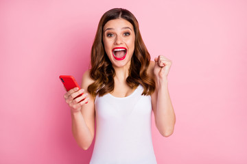 Sticker - Omg yeah i win. Portrait of crazy ecstatic girl use smart phone get social media lottery victory notification scream yes raise fists wear singlet isolated over pink color background