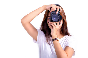 Woman taking a picture with vintage old camera isolated on white background