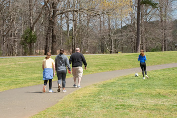 A family walking along a park trail 