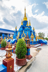 Beautiful blue pagoda at Wat Rong Suea Ten Temple, also known as the Blue Temple. Wat Rong Suea Ten or the Tiger Temple is located near Chiang Rai city, Thailand. Blue sky with dramatic dynamic clouds