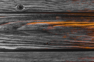 Dark wood texture with orange pattern, abstract old table board or fence background