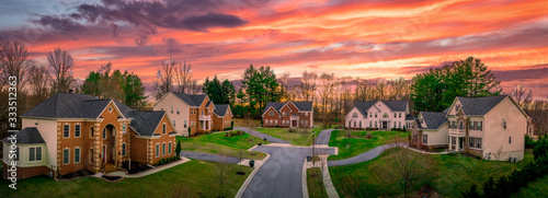 Cuadros en Lienzo Neighborhood street sunset panorama of modern upper middle class single family h