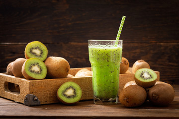 Wall Mural - glass of kiwi juice or smoothie with fresh fruits