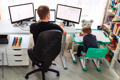 Fotomural Father with kid working from home during quarantine