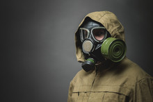 Man In Gas Mask Close Up On Gray Background.