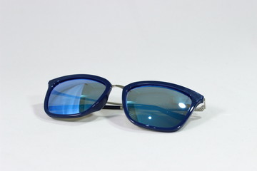 stylish sunglasses with a blue frame on a white background