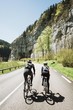 cyclists riding in the french alps two abreast