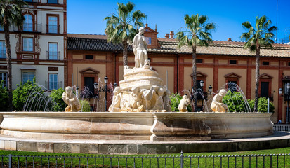 Canvas Print - View of Hispalis fountain, also known as Seville fountain, located in landmark Puerta de Jerez square in old town Seville.