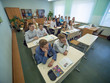 © Довидович Михаил - Students during the lesson are sitting at their desks. Russian school.