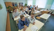 © Довидович Михаил - Students during the lesson are sitting at their desks. Russian school.