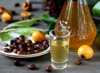 Poster - Liqueur nespolino. Loquat seed liquor. tincture alcoholic on bones loquat . Amaretto with almond flavor. recipe for medlar. alcoholic beverage from the  loquat. tincture on seed loquat. 