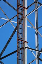 Power And Signal Cables On Telecommunication Tower Against Blue Sky