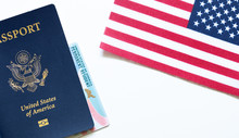 American Passport With Permanent Resident Card (green Card) And United States Flag On White Background. Citizenship And Immigration Background Concept. 