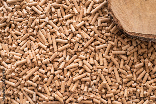 Wooden pellets background, pattern. Close up natural wood pellet. Ecological heating, renewable energy Biofuels. Top view. Flat lay ecological fuel for solid fuel boilers.