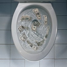Overhead Shot Of Money Being Flushed In The Toilet - Great For Background