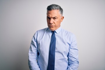 Poster - Middle age handsome grey-haired business man wearing elegant shirt and tie skeptic and nervous, frowning upset because of problem. Negative person.