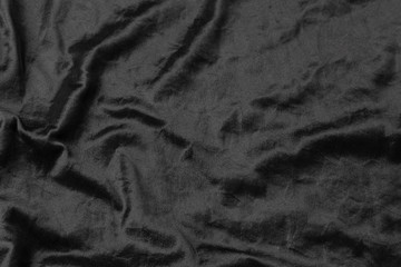 Wall Mural - Abstract black fabric cloth texture background or liquid wave or wavy folds.