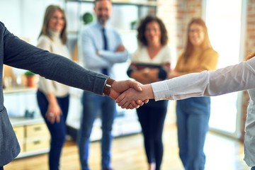 Sticker - Group of business workers standing together shaking hands at the office