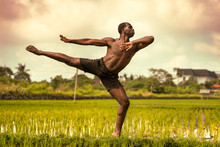 Ballet Dancer And Choreographer Workout - Young Athletic And Fit Black African American Man Dancing Free Outdoors On Tropical Rice Field Background In Fitness  Body Expression Concept
