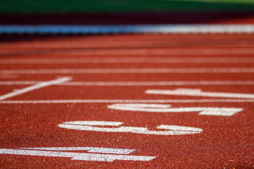 Red running sport track background and texture. Sport running track concept.