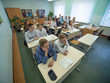 © Довидович Михаил - Students during the lesson are sitting at their desks. Russian school.