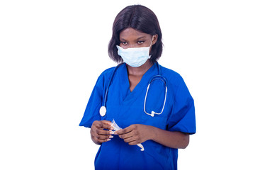 beautiful young female doctor holding a syringe.