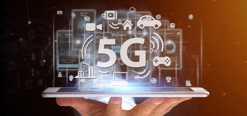 Poster - Businessman holding a 5G connection with data surrounding - 3d rendering